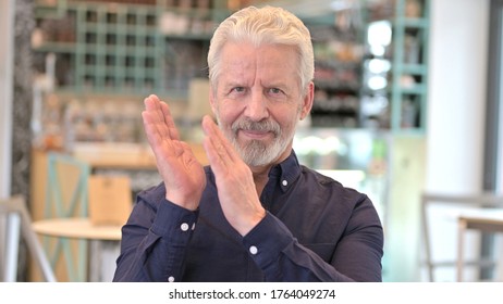 Portrait Of Appreciative Old Man Clapping, Cheering