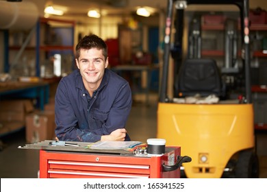 Portrait Of Apprentice Engineer In Factory