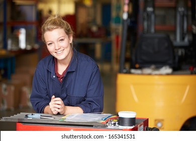 Portrait Of Apprentice Engineer In Factory