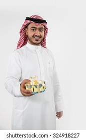 Portrait Of Arab Man Holding Gift Box