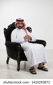 Portrait Of An Arab Man Sitting Down On A Chair.