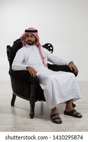 Portrait Of An Arab Man Sitting Down On A Chair.