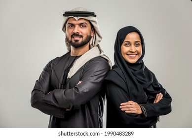 Portrait of arabic couple with traditional clothes in a studio