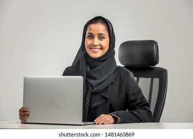 Portrait of arabic woman with abaya dress in a studio