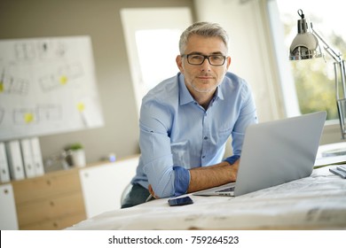 Portrait of architect looking at camera in office