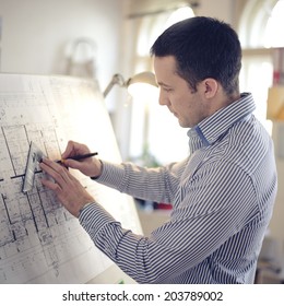 Portrait Of Architect Working On Project