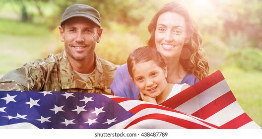 Portrait Of Army Man With Family Against Focus On Usa Flag