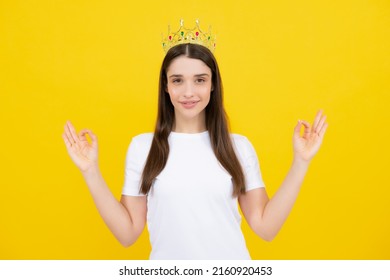 Portrait Of Arrogance Woman With Golden Crown On Head, Leadership And Success. Attractive Rich Arrogant Girl Wearing Crown Isolated Over Yellow Background.