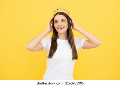 Portrait Of Arrogance Woman With Golden Crown On Head, Leadership And Success. Attractive Rich Arrogant Girl Wearing Crown Isolated Over Yellow Background.