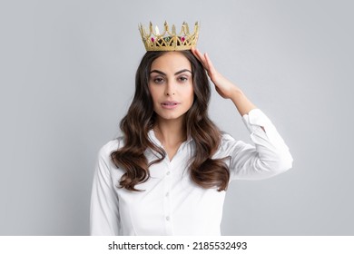 Portrait Of Arrogance Woman With Golden Crown On Head, Leadership And Success. Attractive Rich Arrogant Girl Wearing Crown Isolated Over Gray Background.