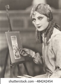 Portrait Of An Artist With Her Easel Painting A Picture Of A Tree