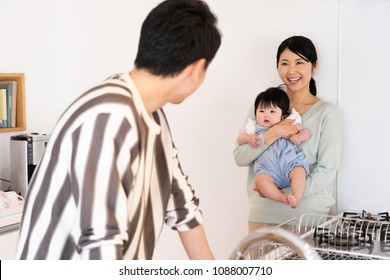 Portrait Of Asain Family In Kitchen