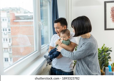 Portrait Of Asain Family In Living Room