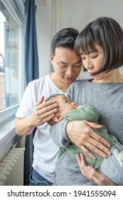 Portrait Of Asain Family In Living Room