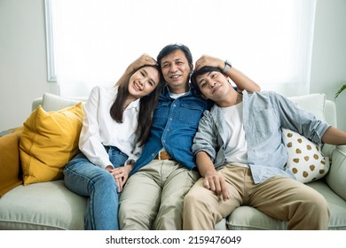 Portrait of asain family in living room. Big Asian happy family spend time having fun on sofa with happiness. Concept of relationship and activity in house - Shutterstock ID 2159476049