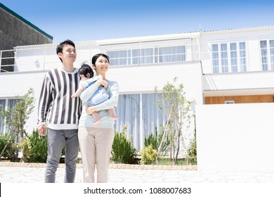 Portrait Of Asain Family On Entrance Of House