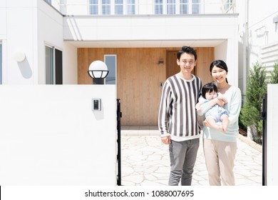 Portrait Of Asain Family On Entrance Of House