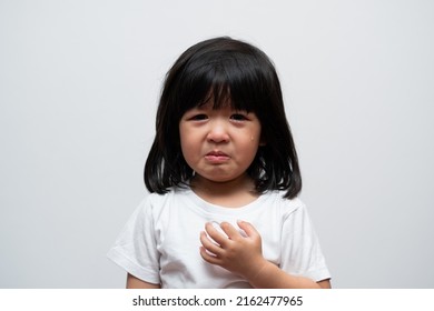 Portrait Of Asian Angry, Sad And Cry Little Girl On White Isolated Background, The Emotion Of A Child When Tantrum And Mad, Expression Grumpy Emotion. Kid Emotional Control Concept