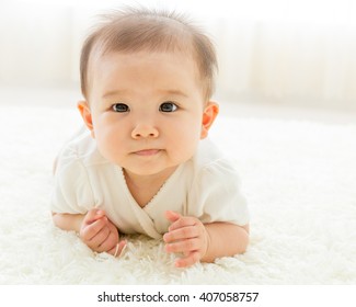 portrait of asian baby isolated in the room