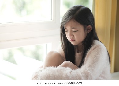 Portrait Of Asian Beautiful Sad Girl At The Window,vintage Filter