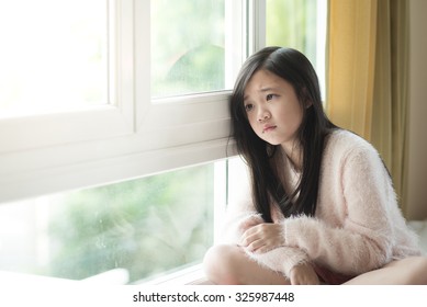 Portrait Of Asian Beautiful Sad Girl At The Window,vintage Filter