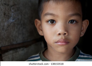 Portrait of an Asian boy from impoverished area in the Philippines
