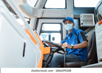 Portrait Of Asian Bus Driver Wearing Uniform And Mask