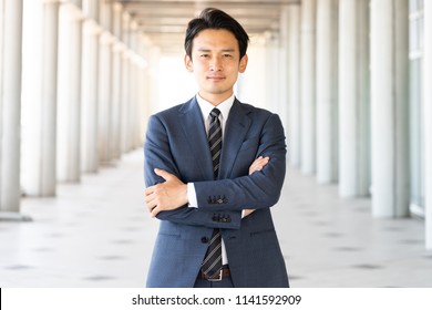 Portrait Of Asian Business Group In Hallway