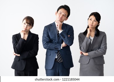 Portrait Of Asian Business Group Thinking On White Background