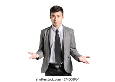 Portrait of an asian business man in a pose I do not know with suit. Isolated on white background with copy space - Shutterstock ID 574008964