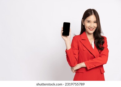 Portrait of Asian business woman in red showing or presenting mobile phone application isolated over white background, Asia Thai model - Powered by Shutterstock