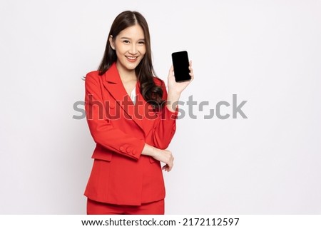 Portrait of Asian business woman showing or presenting mobile phone application isolated over white background, Asia Thai model