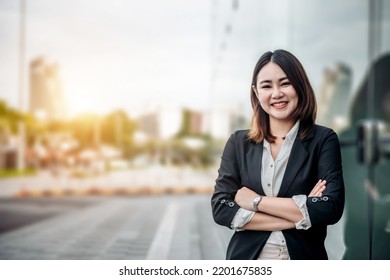 Portrait Of Asian Business Woman Smiling And Embrace Outdoor Of Her Office Or Airport