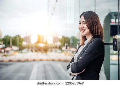 Portrait Of Asian Business Woman Smiling And Embrace Outdoor Of Her Office Or Airport