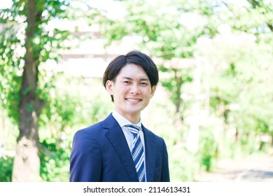 portrait of Asian businessman looking at camera - Shutterstock ID 2114613431