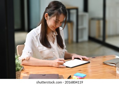 Portrait With Asian Businesswoman Use Stylus Pen Write On Tablet, White Screen Of Tablet.