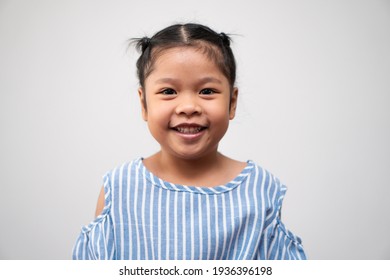 Portrait Of Asian Child 5 Year Old And To Collect Hair And A Big Smile On Isolated White Background, She Is Happiness, Radiance In Youth