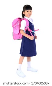 Portrait Of Asian Child In School Uniform With School Bag On White Background Isolated.