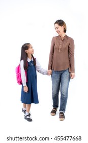 Portrait Of Asian Child In School Uniform Holding Hand With Mother On White Background Isolated