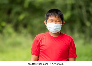 portrait Asian children student boy wear face mask - Powered by Shutterstock