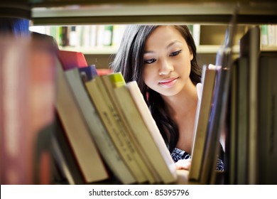 A Portrait Of An Asian College Student In Library