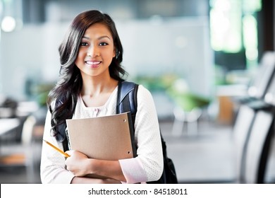 A portrait of an Asian college student on campus - Shutterstock ID 84518011