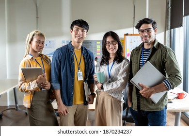 Portrait Of Asian Creative Business Team. Creative Startup Young Business People In Modern Office.