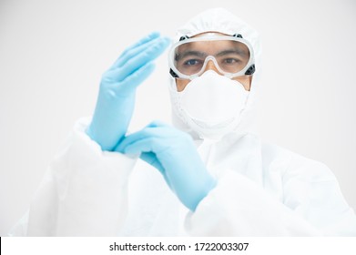 Portrait Asian Doctor In Protective PPE Suit Wearing Face Mask And Eyeglasses For Protect Coronavirus Covid-19 Virus.Scientist Male Wearing Personal Protection Equipment Making Laboratory In Hospital.