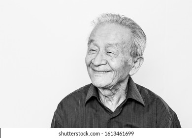 Portrait Of Asian Elderly Senior Man. Smiling, Happy Old Age. Black And White Photo. 