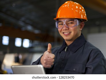 Portrait Asian Engineer With Laptop Showing Thumb Up And Smile