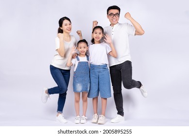 Portrait of Asian family on white background