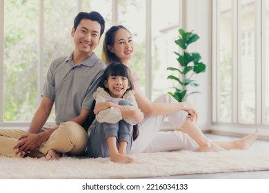 Portrait Of Asian Family Sitting On Floor Posing Smiling Happy Moment Of Unity Family Love Together At Home, Family Quality Time Concept