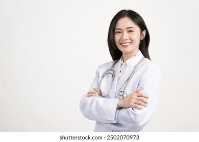 Portrait of asian female doctor wearing medical uniform and stethoscope at hospital.Beautiful smiling young woman doctor isolated on white background.Doctor arms crossed wear white coat. - Powered by Shutterstock