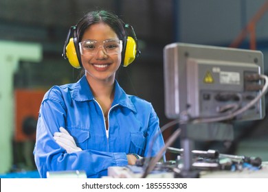 portrait asian female Professional engineering wearing uniform and safety goggles Quality control, maintenance, check in factory, warehouse Workshop for factory operators - Powered by Shutterstock